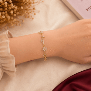 انسيال ستانلس ستيل ذهبي مزين بزهور وفصوص / Gold Stainless Steel Floral Bracelet